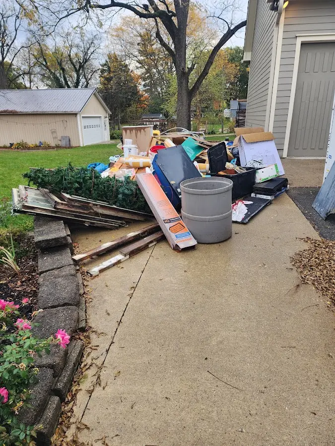 Dumpster being loaded with debris for Demolition Dumpster Rental in South Brunswick